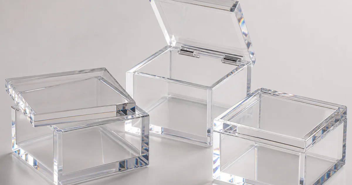 Seven clear cast acrylic boxes with lids shown side by side, each with a different closure — lift-off, telescoping, hinged, snap-fit, magnetic, lockable, and gasket-sealed PMMA lids