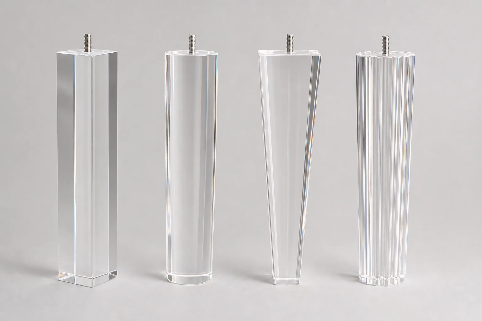 Four acrylic leg profiles — square, cylindrical, tapered, and fluted — on neutral studio background