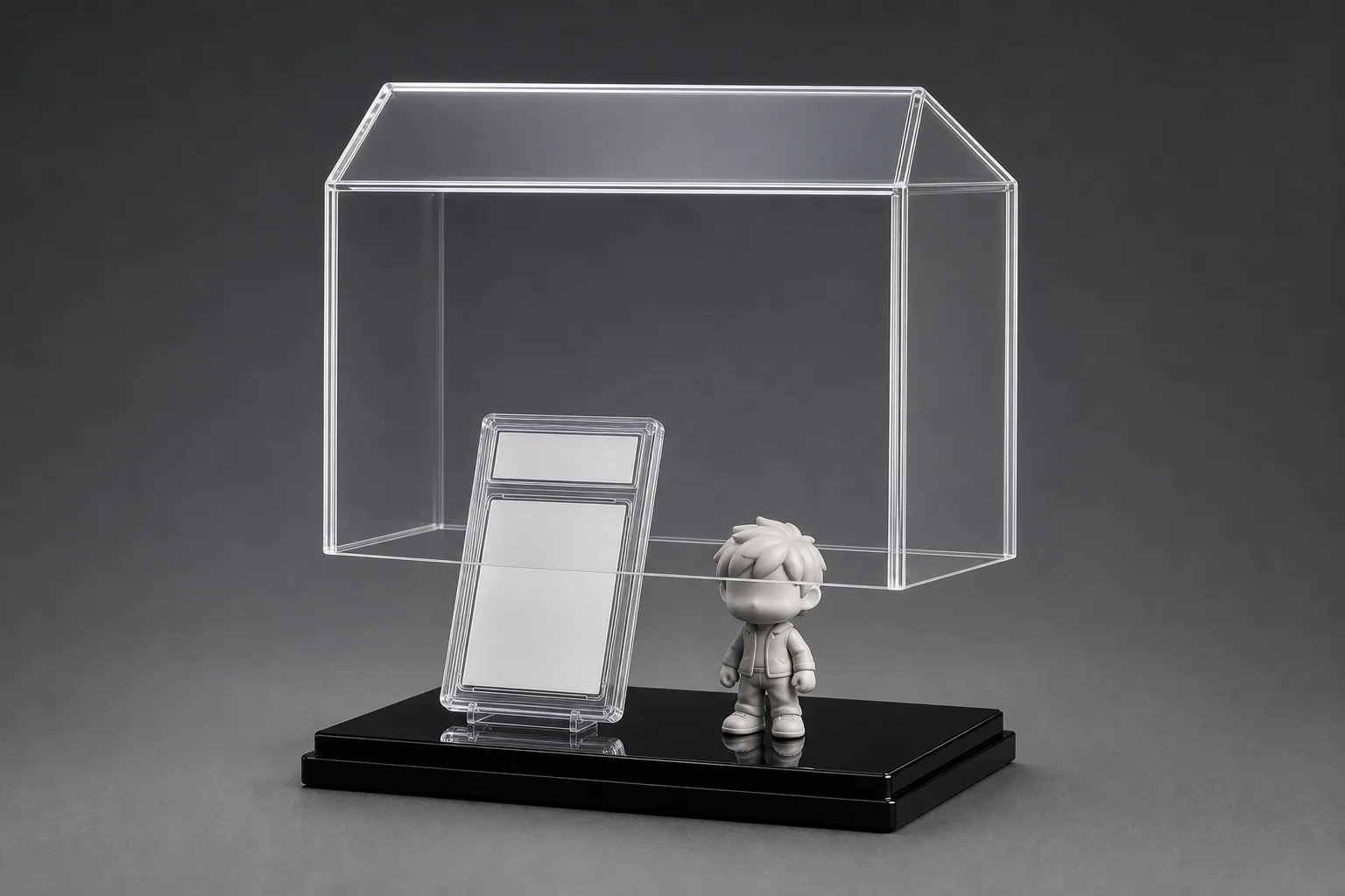Clear one-piece acrylic display case cover raised above a graded card and figurine on a black acrylic base, dust-tight flush seam visible