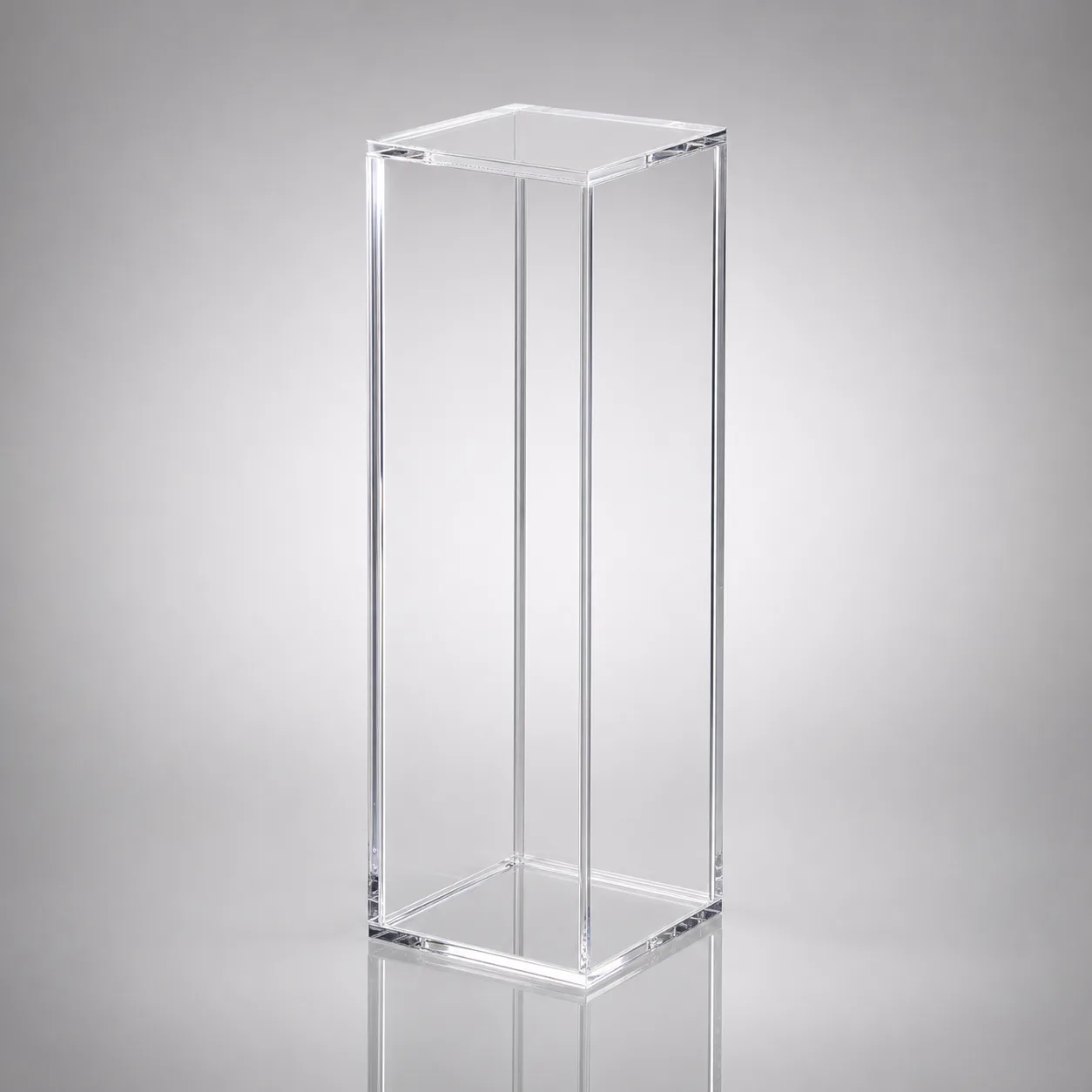 Clear acrylic pedestal column raising a single hero product in a retail window display