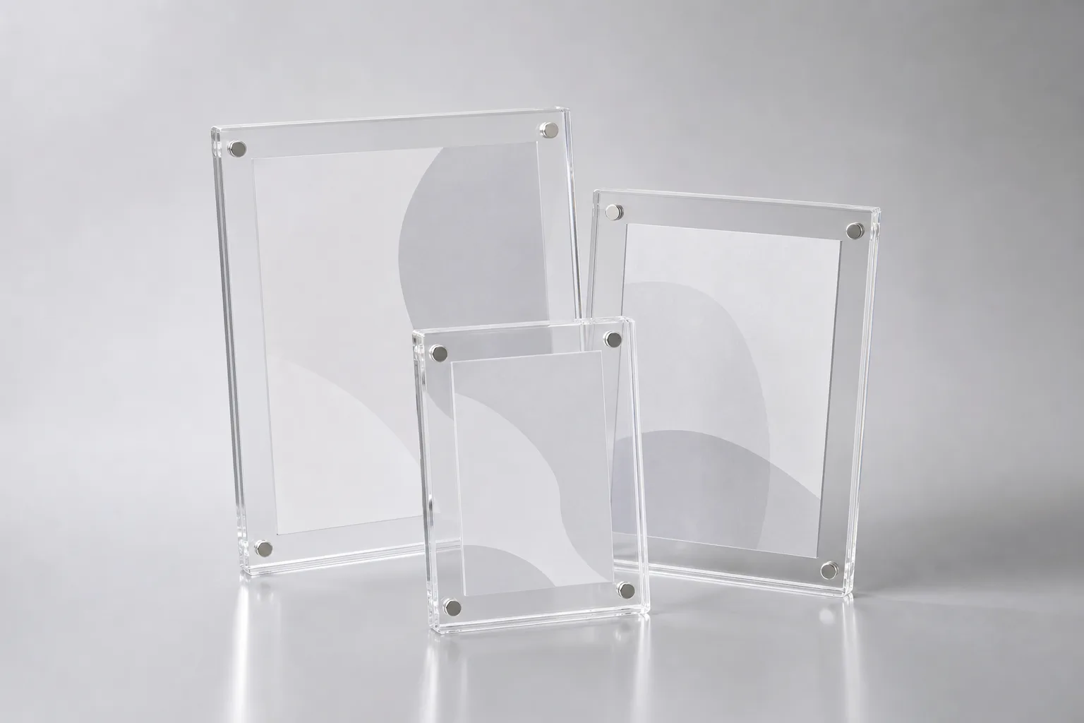 Custom acrylic magnetic frames in clear acrylic holding a photo, certificate, and menu insert, with visible corner magnets